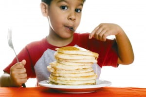 kid eating pancakes